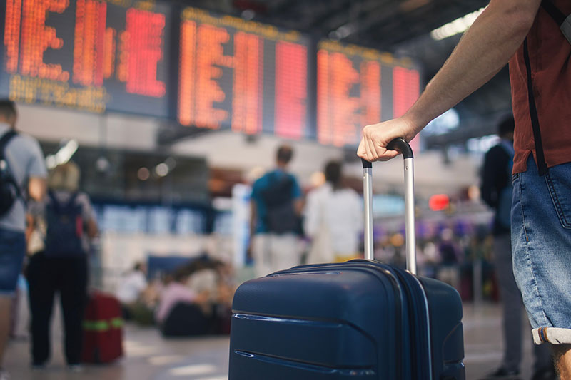 Traveller with luggage at the airport